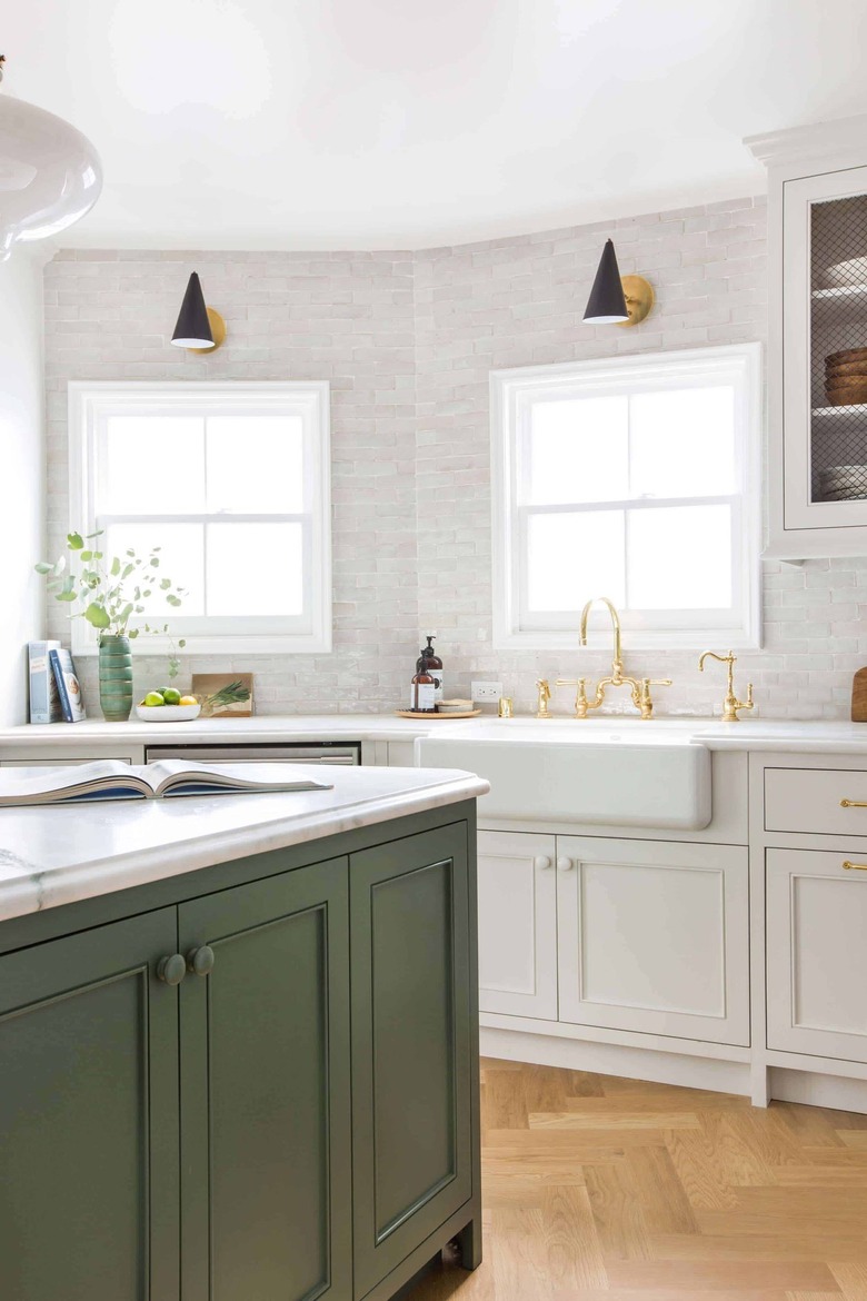 green and white kitchen with subway tile backsplash