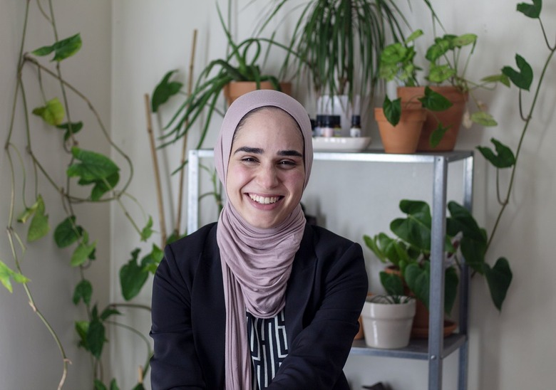 Summar Saad in her home with plants in the background