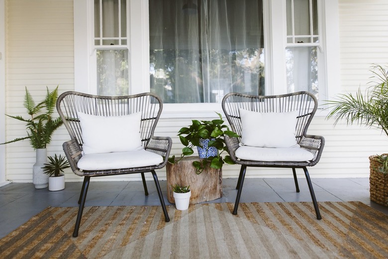 two chairs on porch with small side table