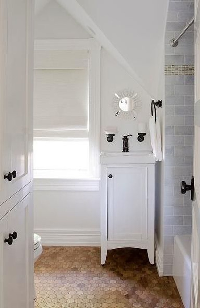 white bathroom with hexagonal cork flooring