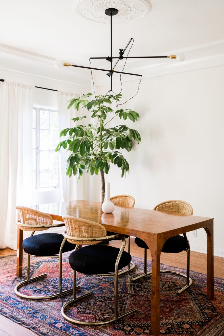 Cane cantilever chairs in a bohemian dining room