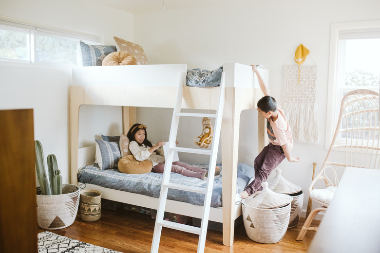 Kids playing on wood bunkbed with California cool furnishings