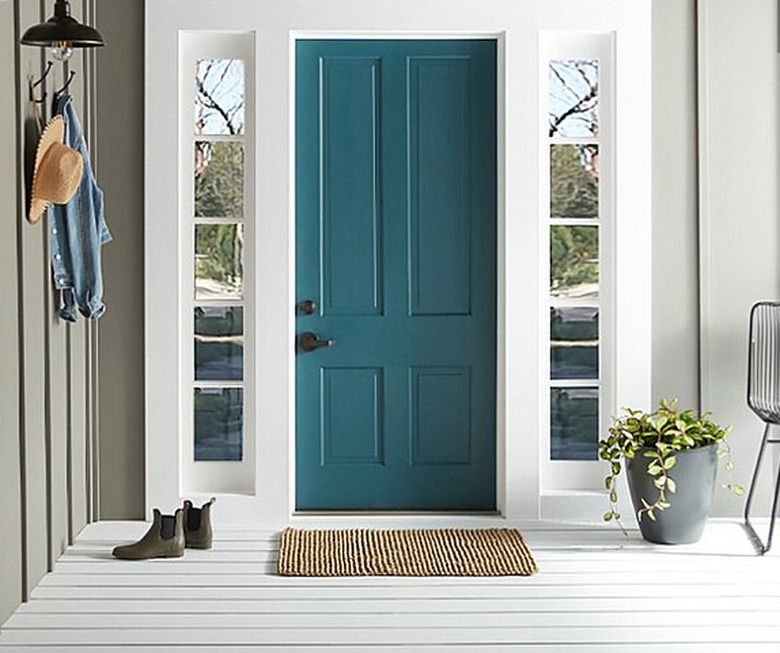 teal color front door with white trim and khaki walls