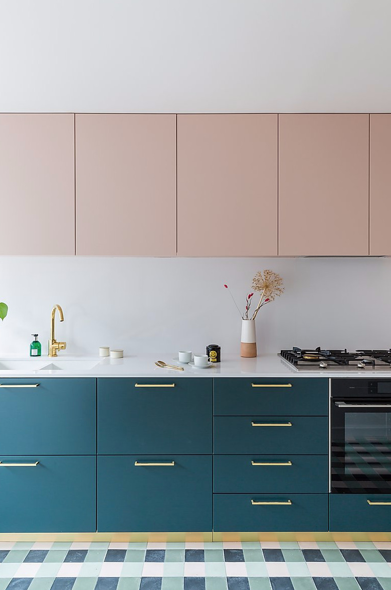 pale pink upper cabinets with teal color lower cabinets and white countertop