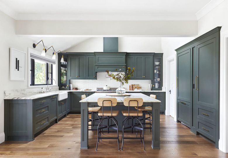 teal kitchen island with shaker cabinetry