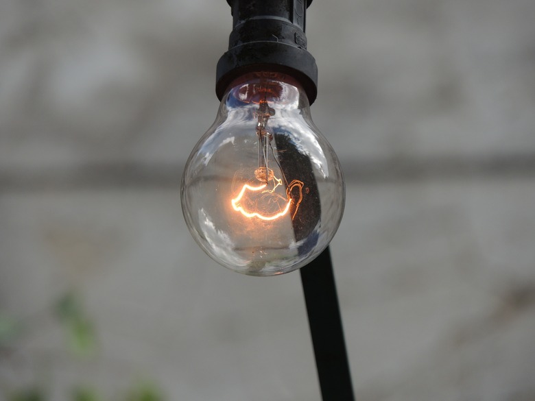 Clear incandescent bulb filament glowing.