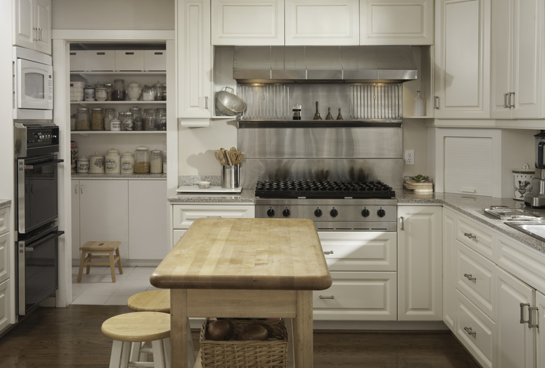 Wooden counter and stove in modern kitchen