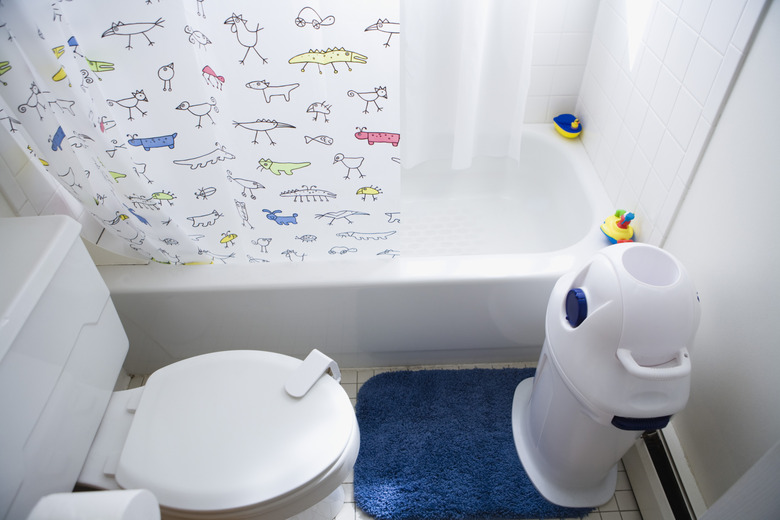 Bathroom with diaper disposal bin