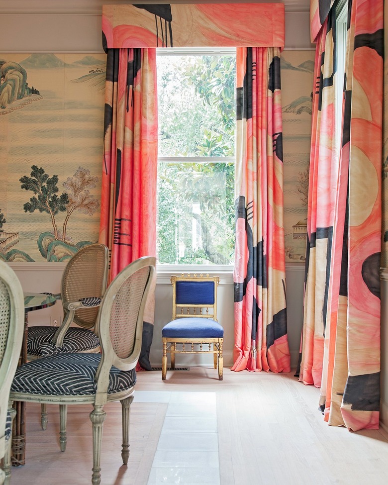 dining room with water color inspired wallpaper and flows drapes