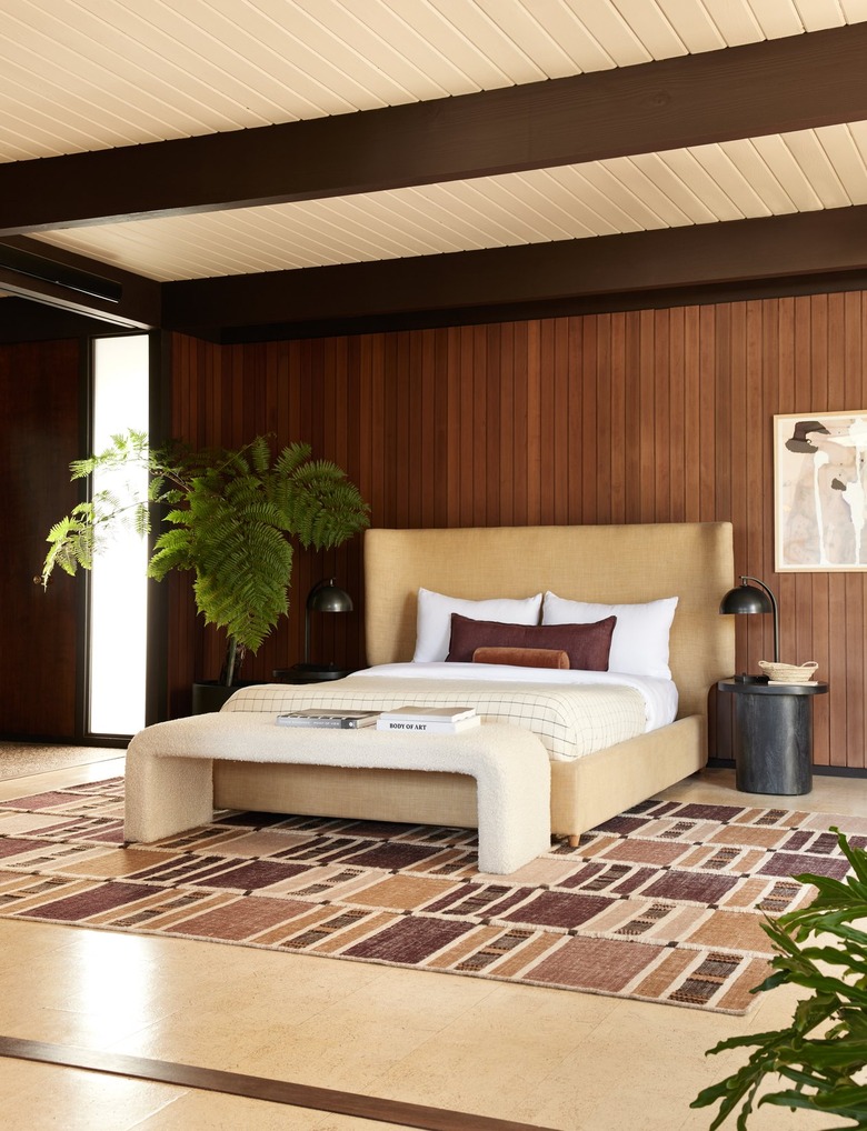 bedroom area with brown rug