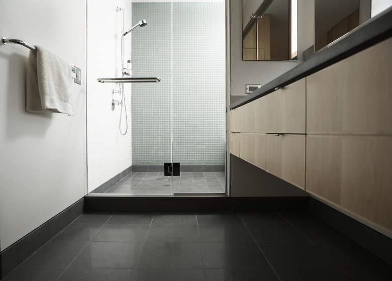 Shower stall with glass door in domestic bathroom