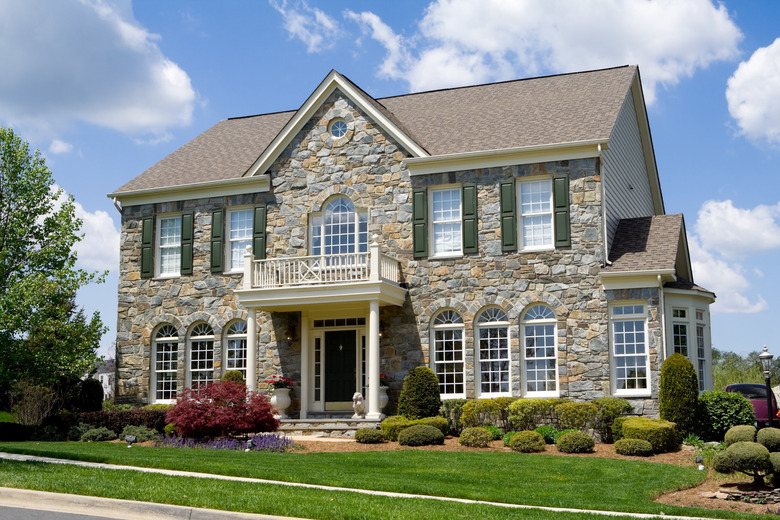 Front view of stone-faced single-family house in suburban Maryland.