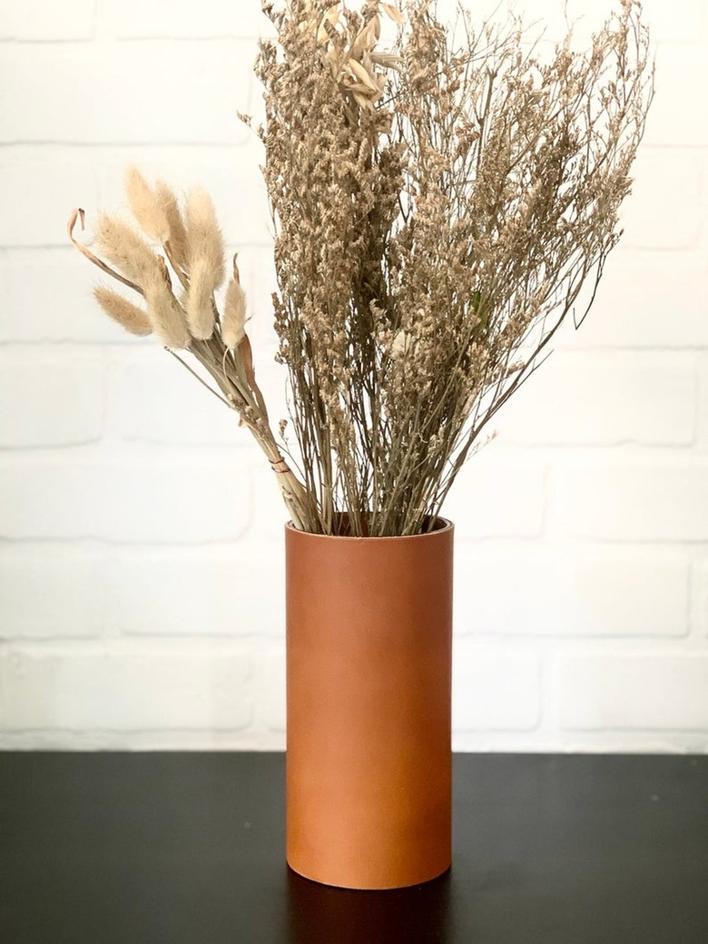 leather vase with detailed stitching