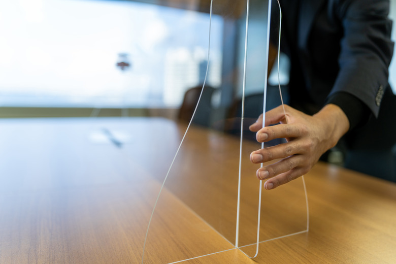 Installing acrylic glass on desktop.