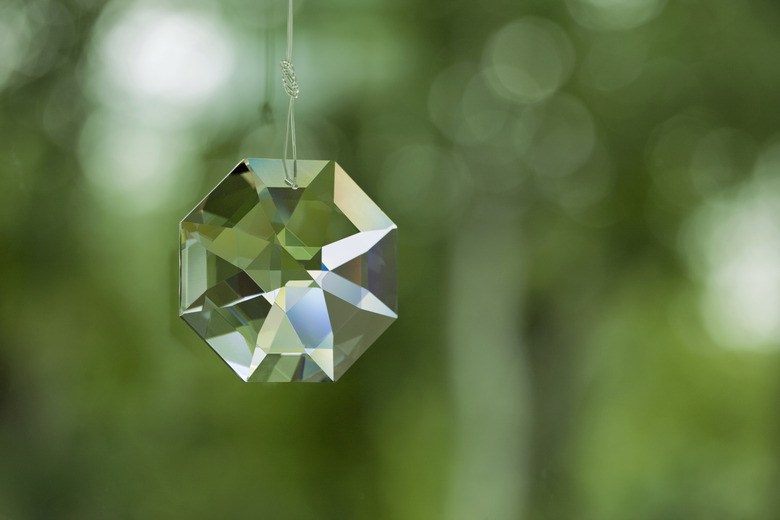 Crystal prism on defocused green background