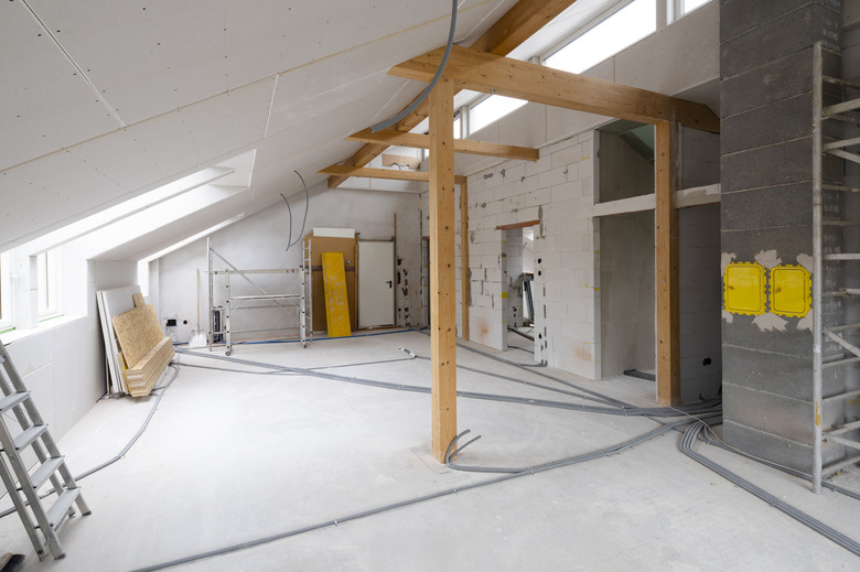 Loft construction site drywall without people in daylight.