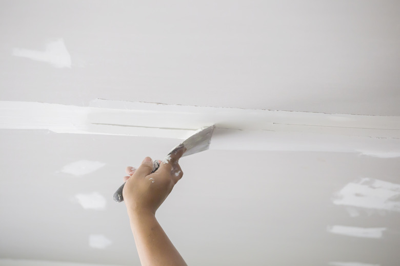 Hands of the ceiling technician