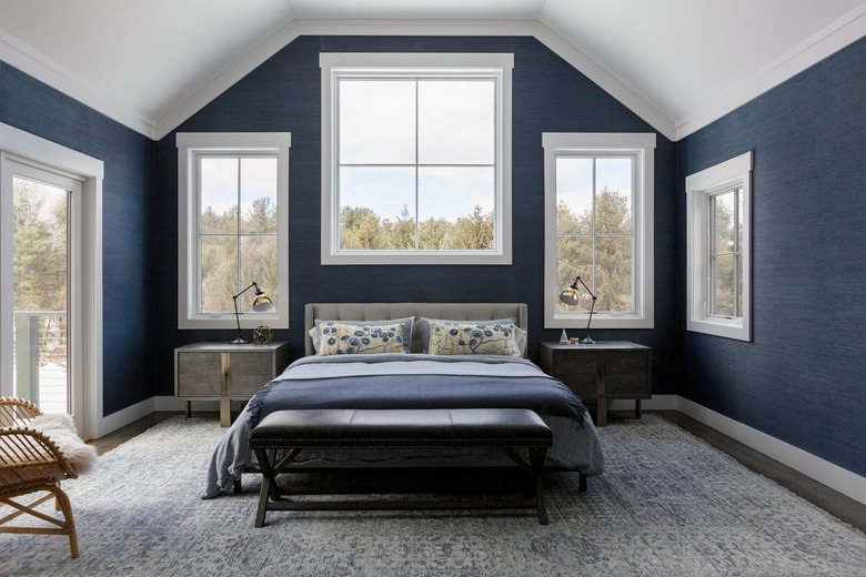 The master bedroom with navy grasscloth on the walls