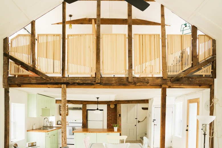 a kitchen is visible through a half-timbered atrium