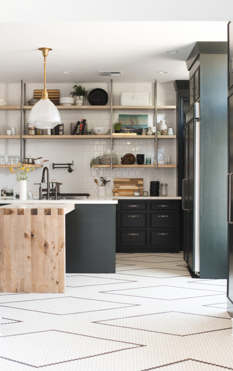 Kitchen floor tile ideas with geometric shapes and black cabinets