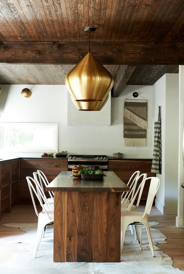 modern rustic farmhouse eat-in kitchen with walnut wood table and cabinets