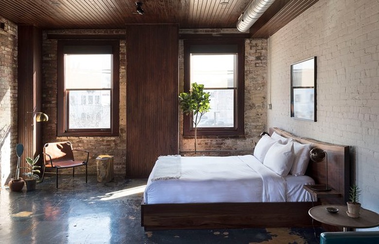 industrial hotel room with exposed wood cement and metal