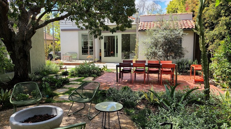 A variety of modern hardscapes in this expansive backyard