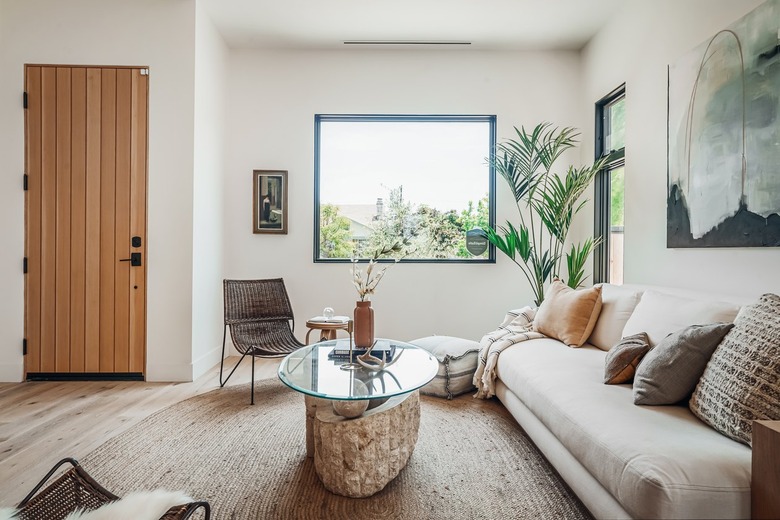 living room with palm plant in corner