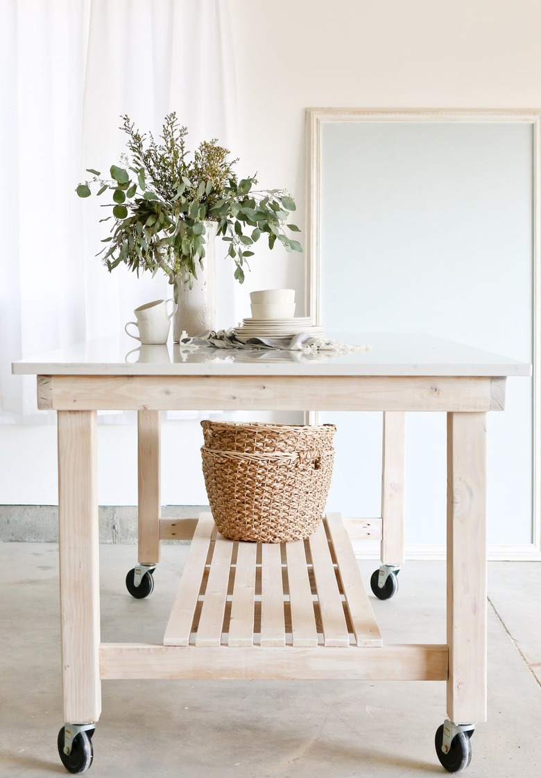 rolling wood kitchen island with bottom shelf for baskets