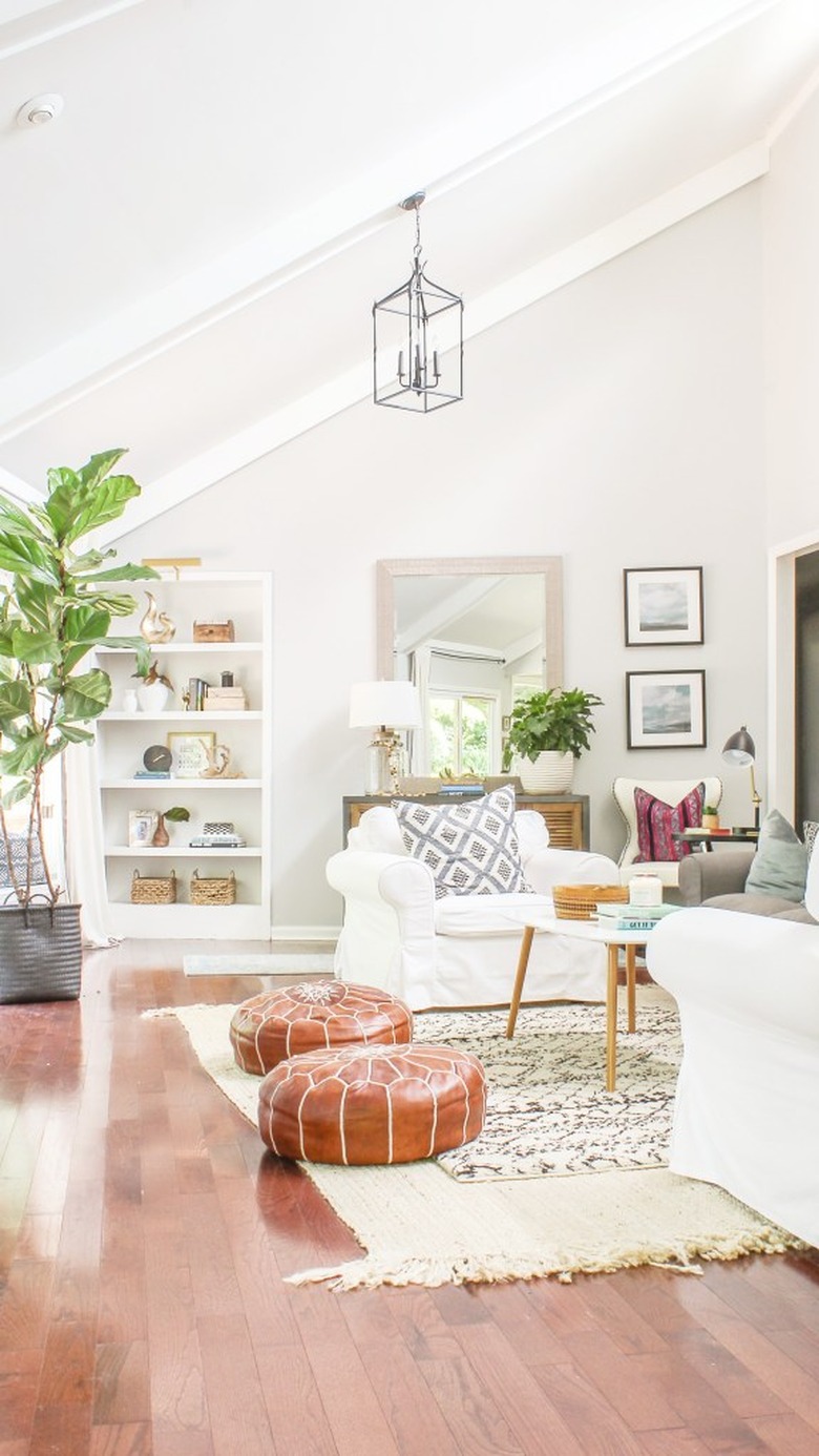 white living room shelving idea with layered rugs