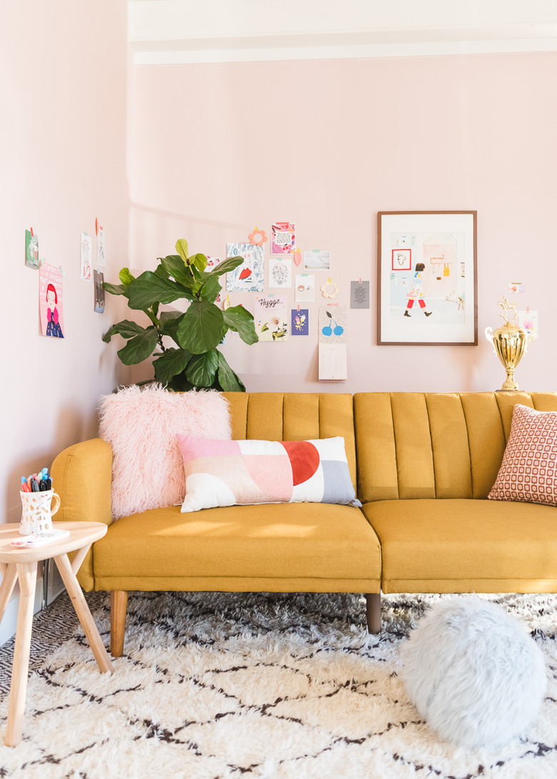 pink living room with channel tufted sofa