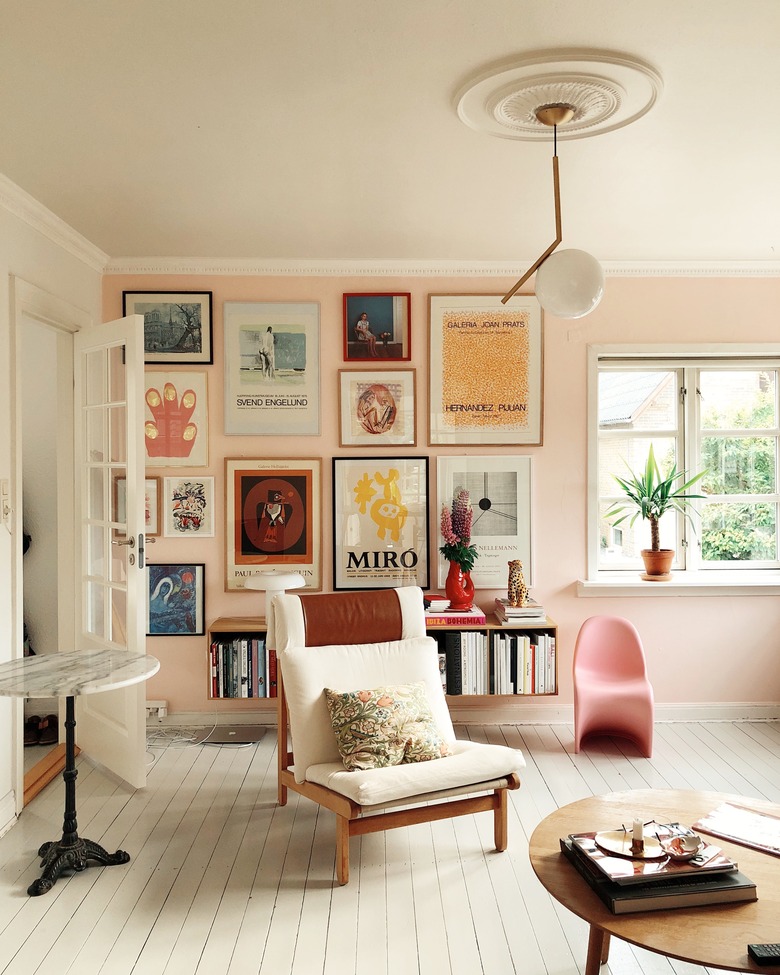 pink living room with gallery wall and modern furniture