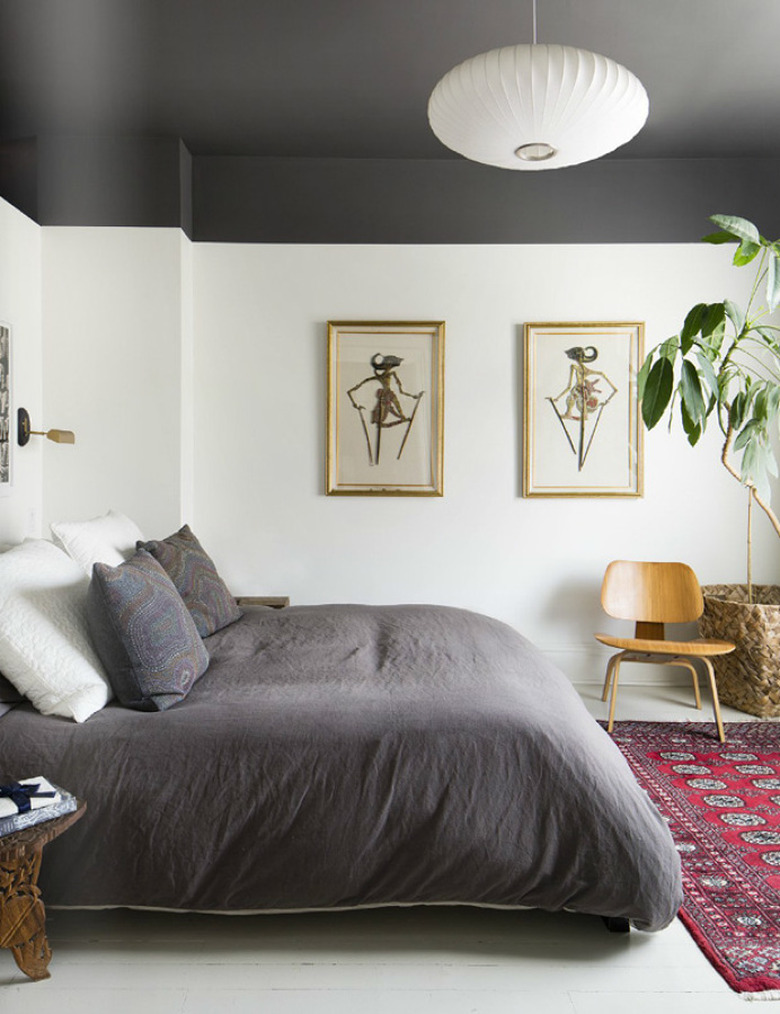 Bedroom featuring matching gray bedding and ceiling