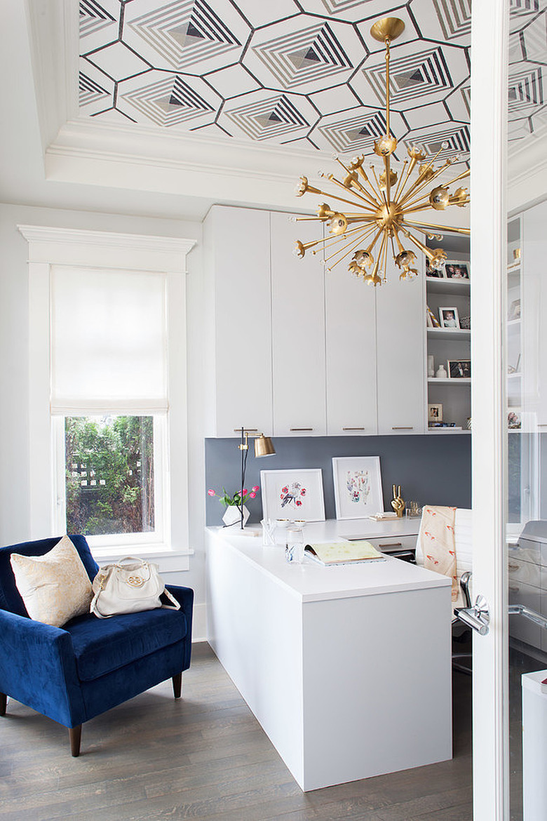 White and blue office with white and blue graphic ceiling