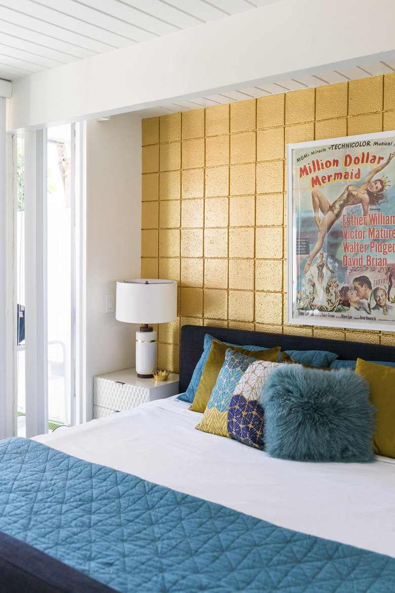 bedroom with yellow brick wall