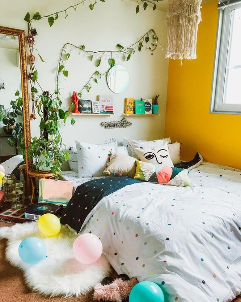 bohemian bedroom with yellow accent wall