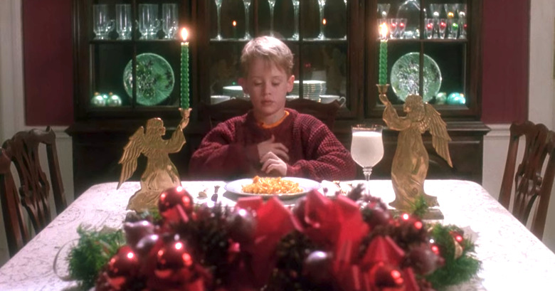 young boy sitting at christmas table, still from home alone set