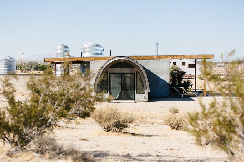 a view of the nearly cylindrical entryway to a desert home