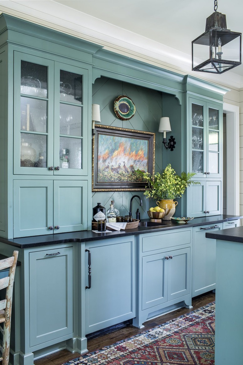 blue-green custom kitchen cabinets and colorful runner