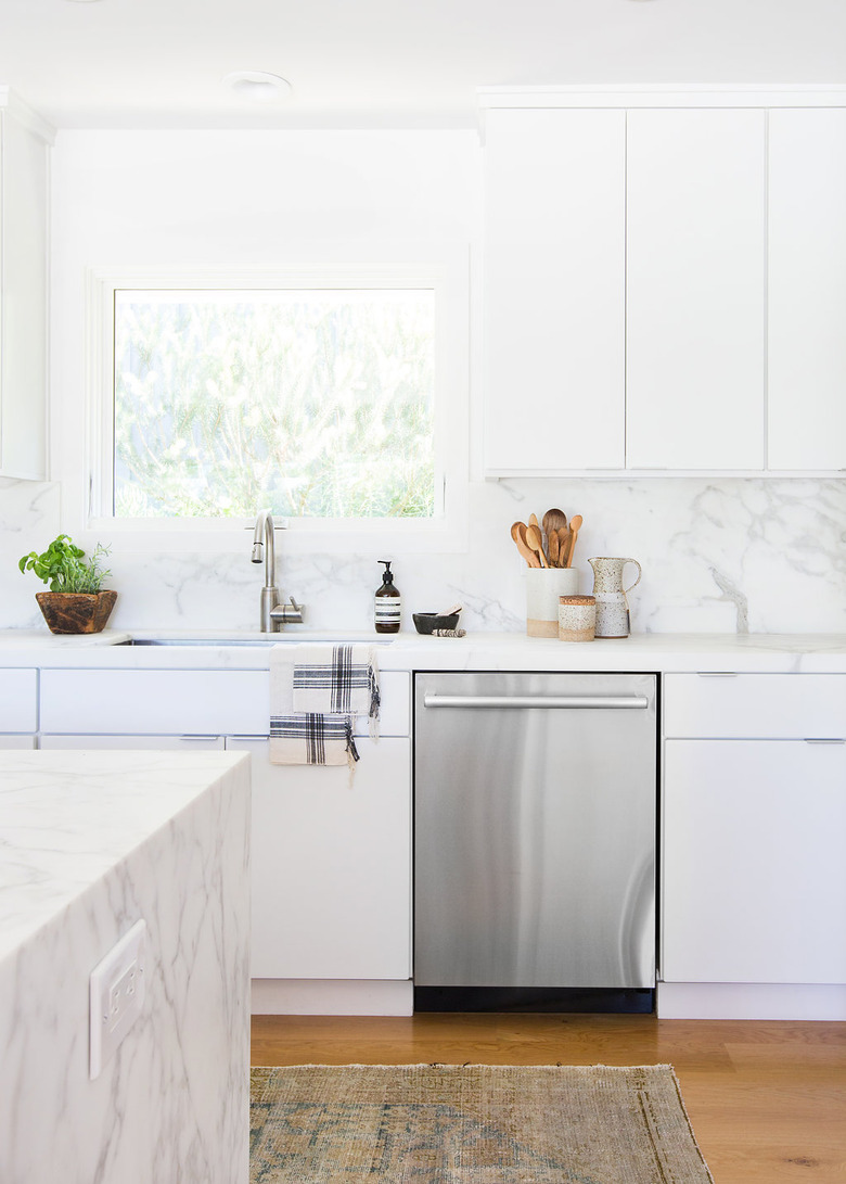 White kitchen design in white marble kitchen