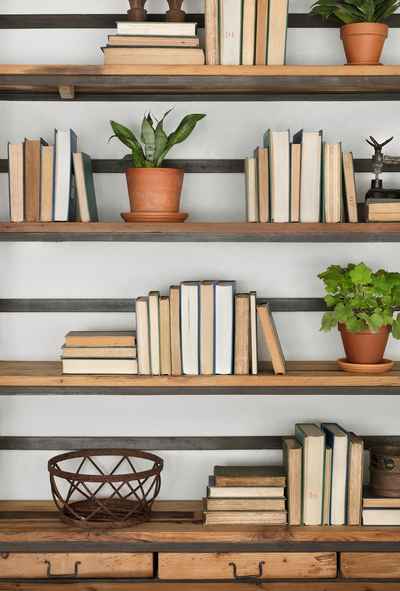 books turned backwards on bookcase