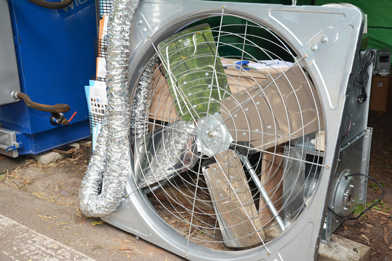 A close-up of an attic ventilator, roof ventilator fan in a steel construction for house ventilation.