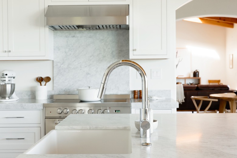 close up of chrome kitchen faucet in kitchen island