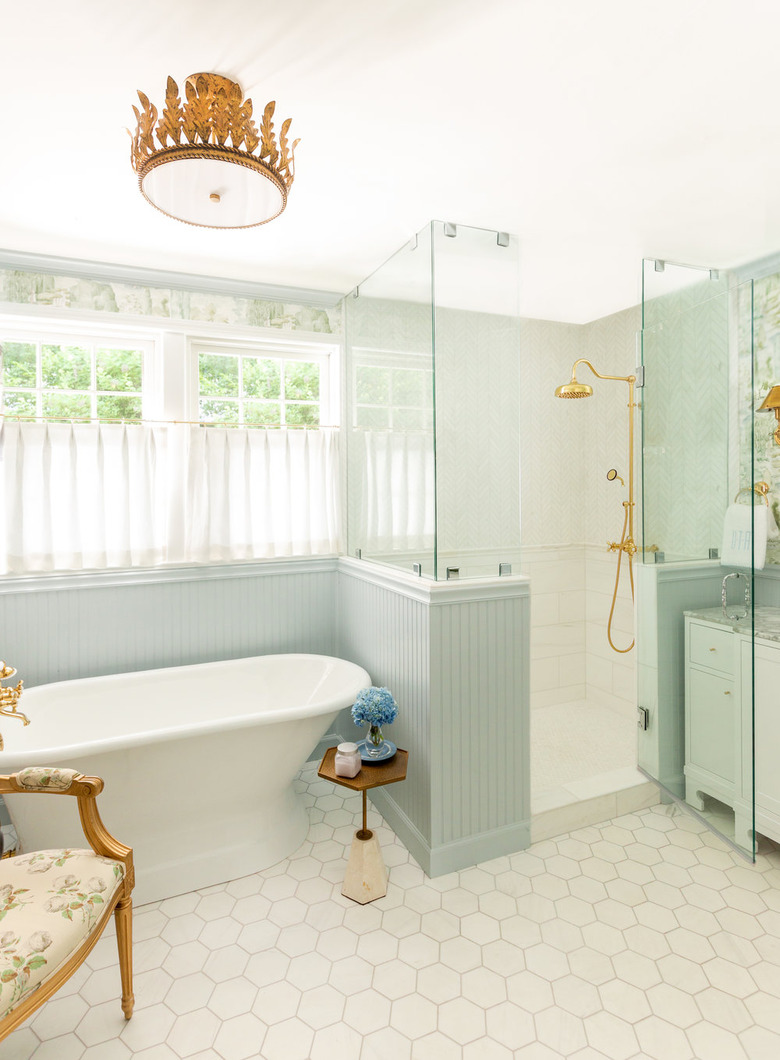 traditional shower fixtures in bathroom with blue tile