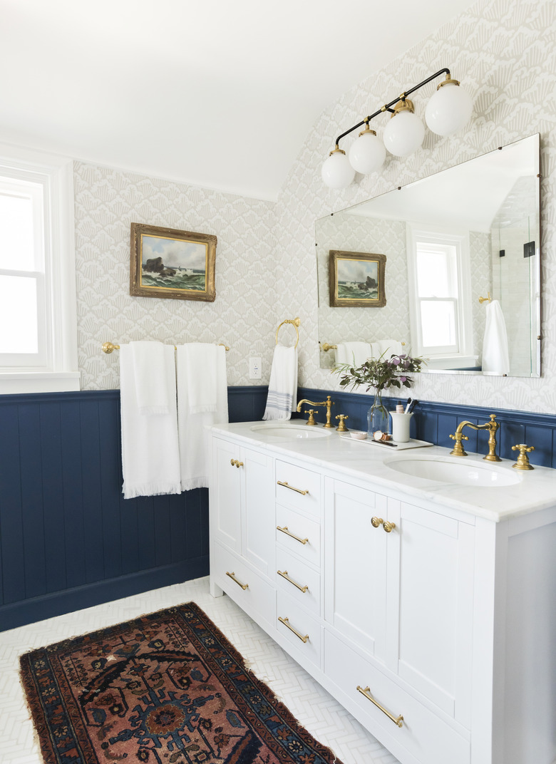 White traditional bathroom vanity idea with blue wainscoting and double sinks