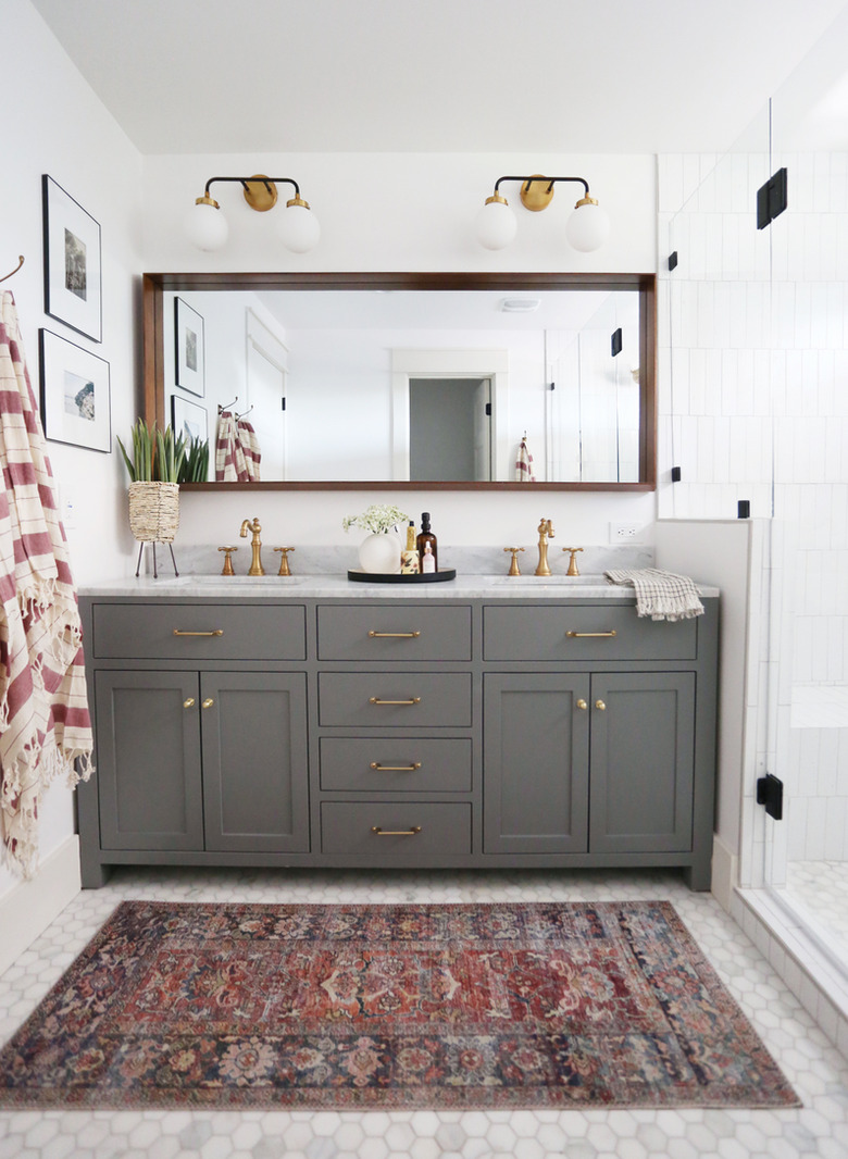 Gray traditional bathroom vanity idea with brass pulls and double sinks