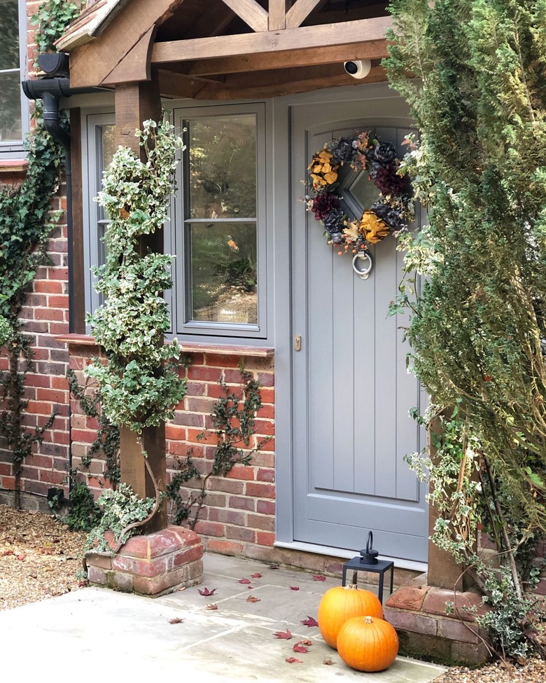 Traditional brick home with ivy and seasonal florals