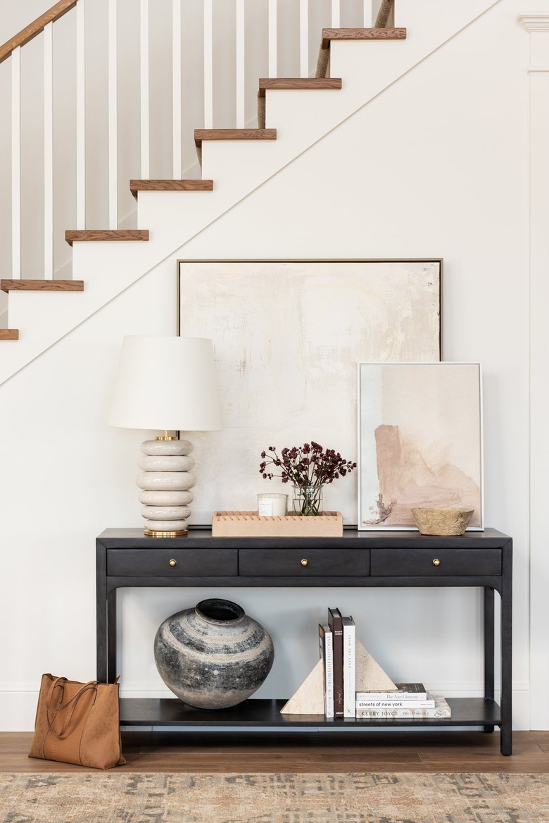 Traditional entryway table with modern ceramic lamp and neutral decor accents