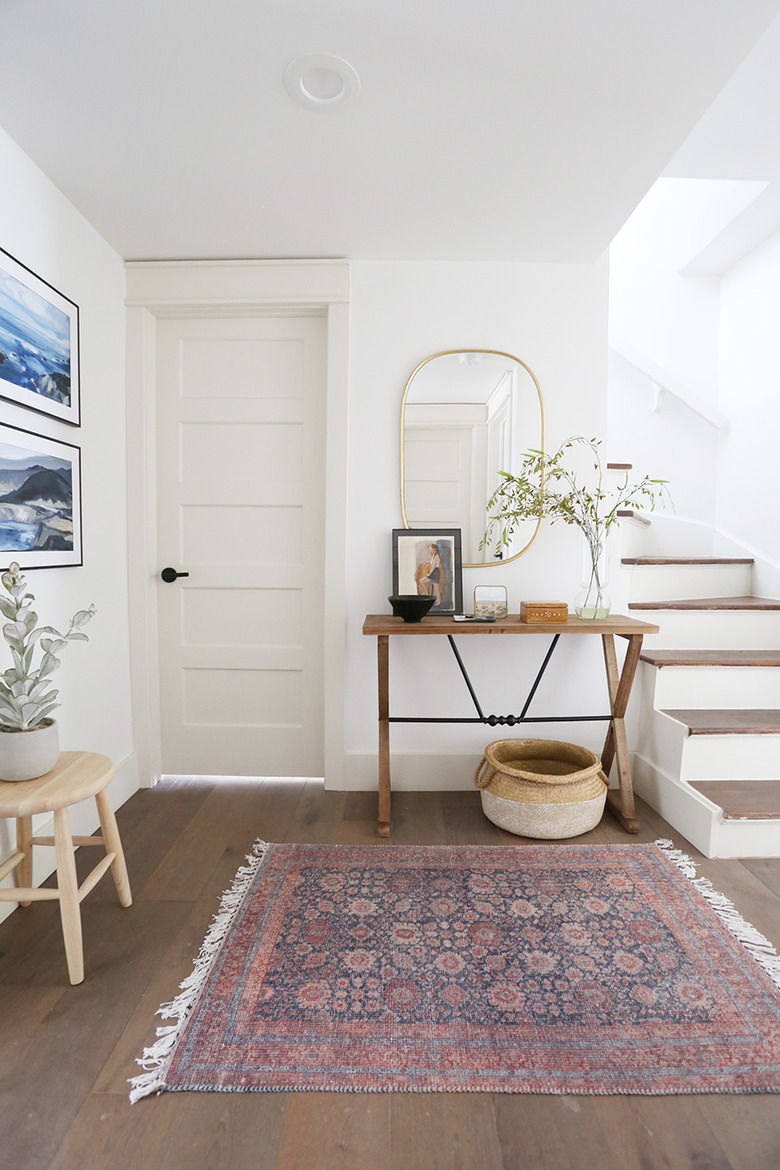 Traditional entryway table with vintage decor and artwork