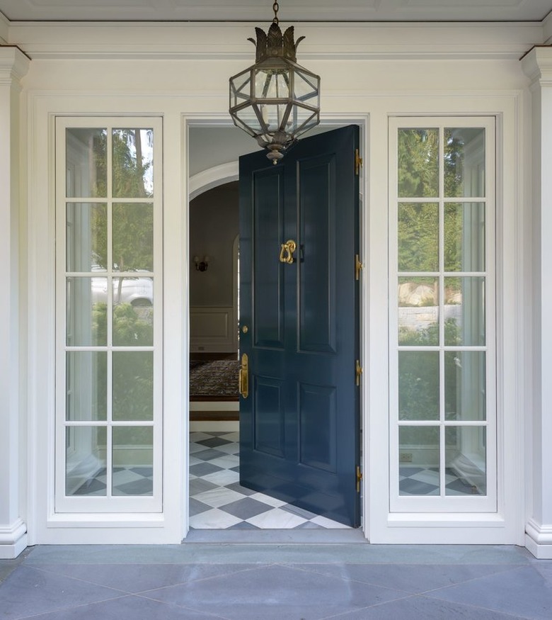 blue traditional front doors with gloss and brass door knocker